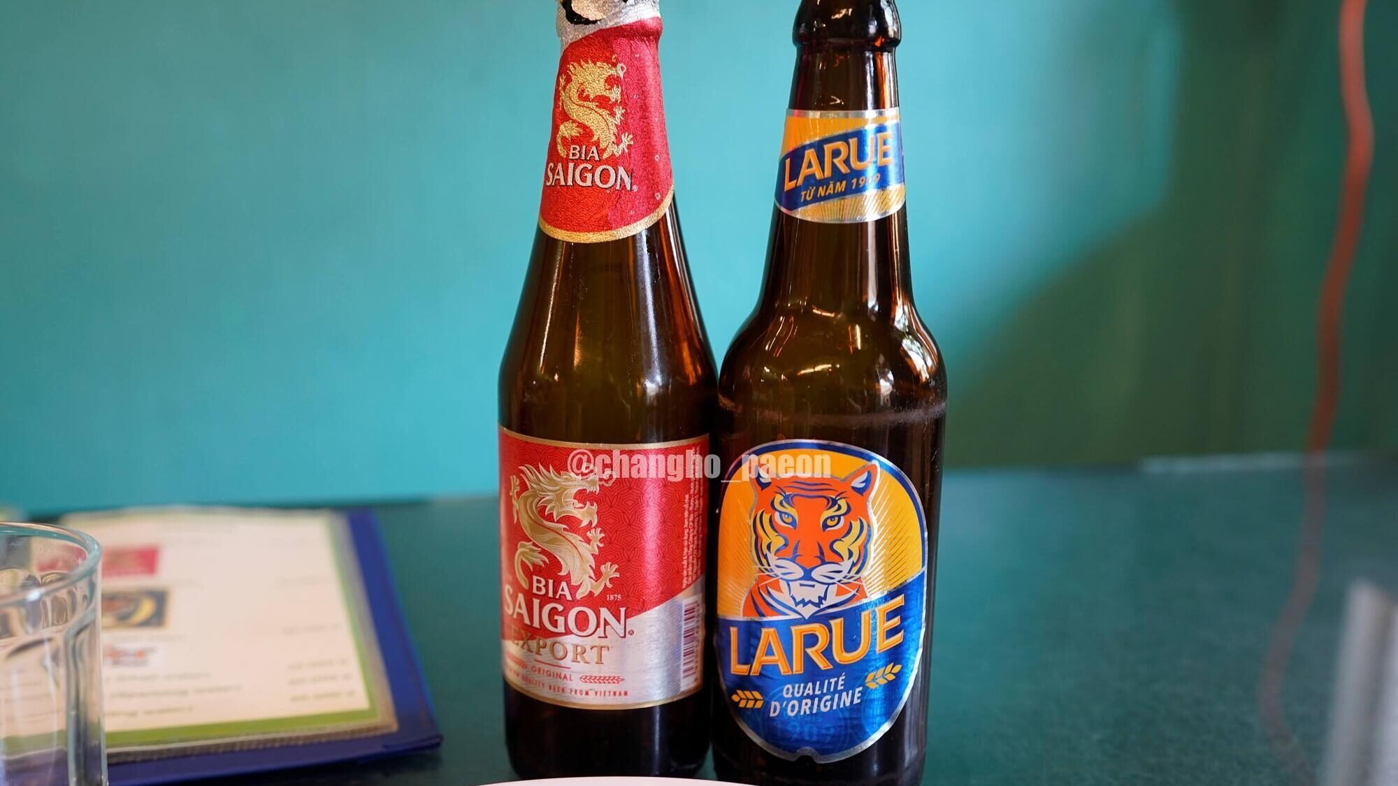 Larue and Saigon beer side by side